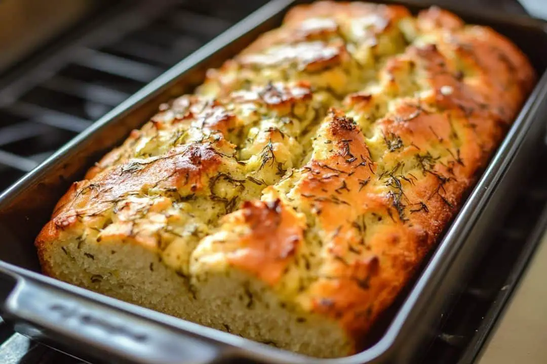 This Dill Pickle Bread is a unique and flavorful loaf with a tangy twist, perfect for pickle lovers. It’s moist, slightly tangy, and pairs well with savory spreads or can be enjoyed on its own.